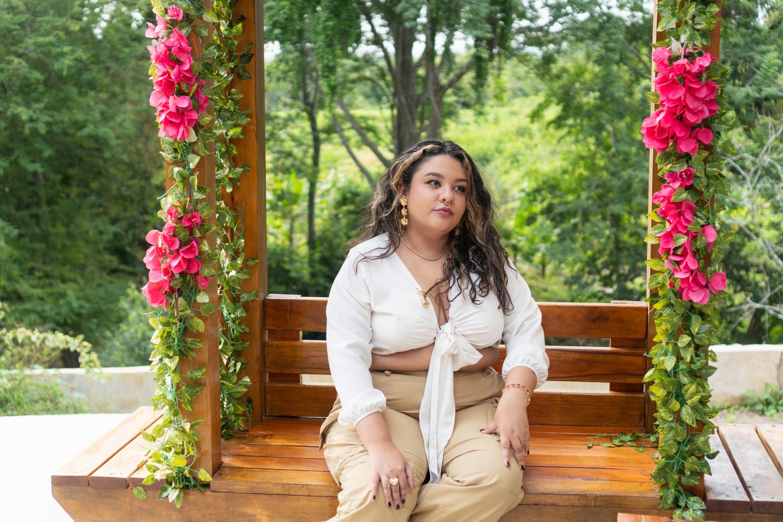 Woman seated outdoors in a natural lifestyle setting